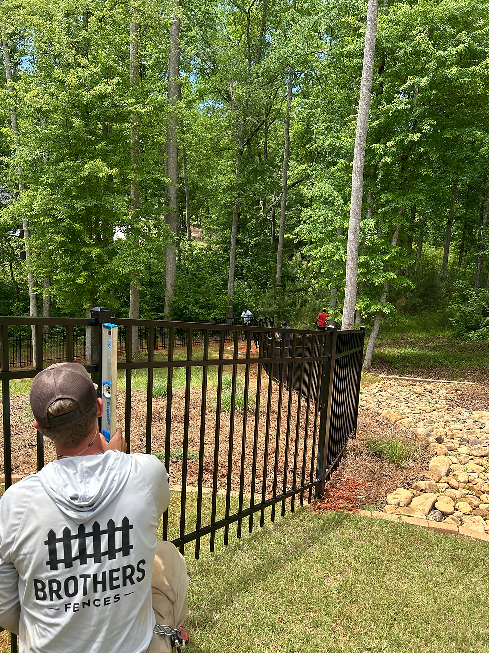 Brothers Fences Employee Installing Pool Fence