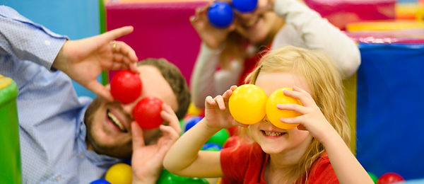 family-covering-eyes-with-balls.jpg