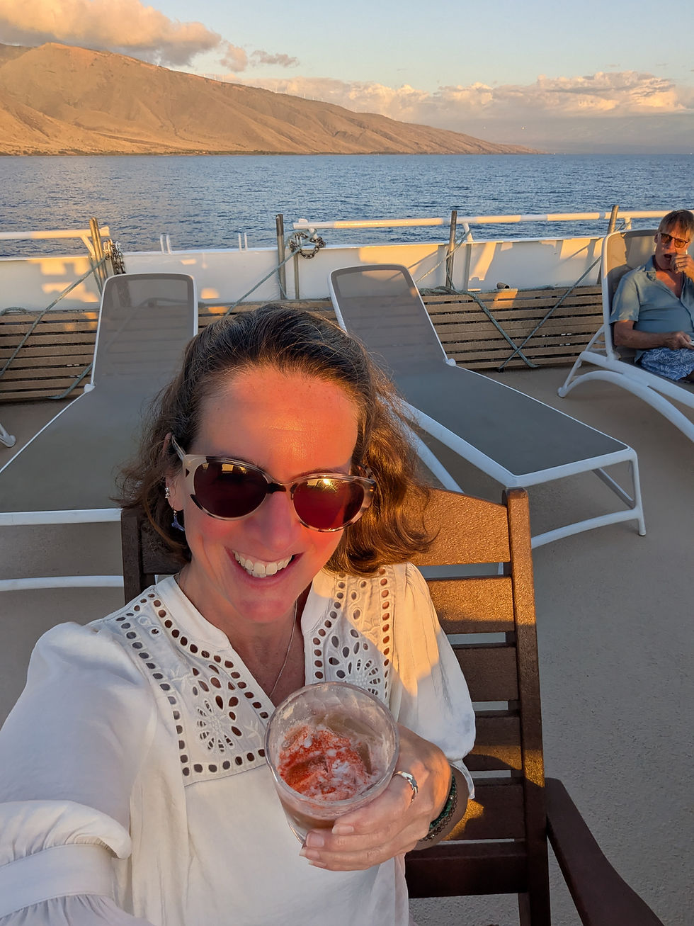 The top deck of Safari Explorer was a perfect spot for a sunset happy hour