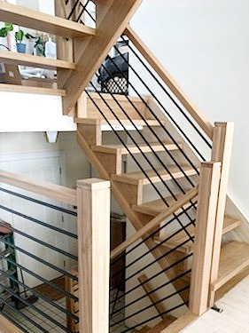 modern horizontal black bars, railings with wood posts