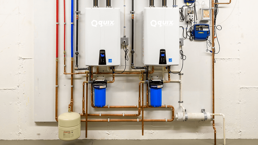 Two professionally installed tankless water heaters with connected copper plumbing and filtration systems, showcasing energy-efficient design.