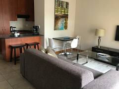 Lounge and kitchen of fully furnished 2-bedroom townhouse in Pentagon Park Bloemfontein
