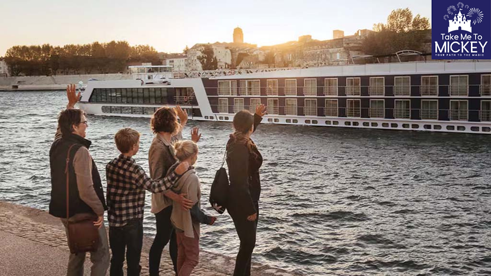 Family on dock waving at an Adventures by Disney river cruise ship with Take Me To Mickey logo