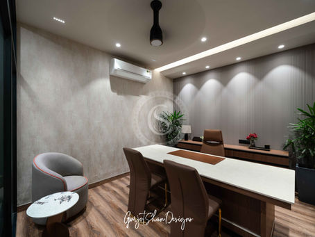 Modern HML office interior designed and executed by Gurjot Shan Designs, featuring a contemporary meeting space with custom furniture and wall detailing.