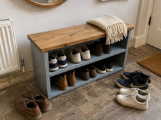Handcrafted solid wood furniture in a cosy UK home with natural textures and warm tones