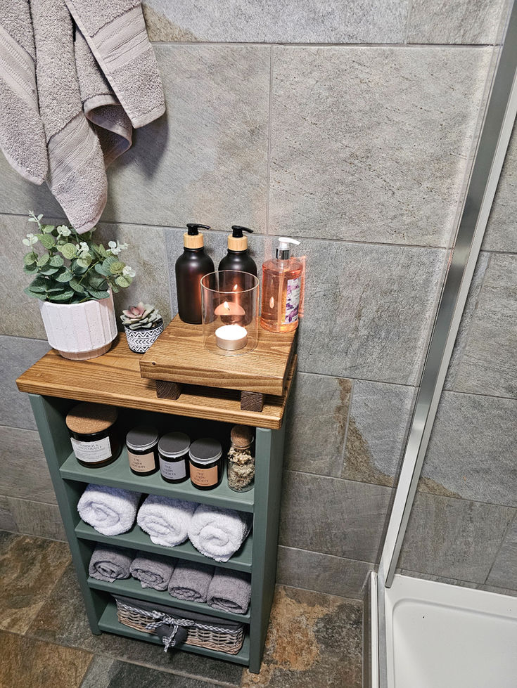 Handmade solid wood shelf storage unit in a bathroom.