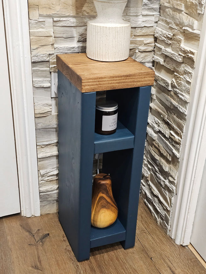Slim solid wood side table used as narrow bedside and lamp table