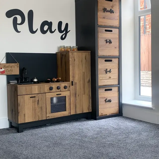 Rustic wooden crates fitted into IKEA KALLAX cube storage unit in a UK home.