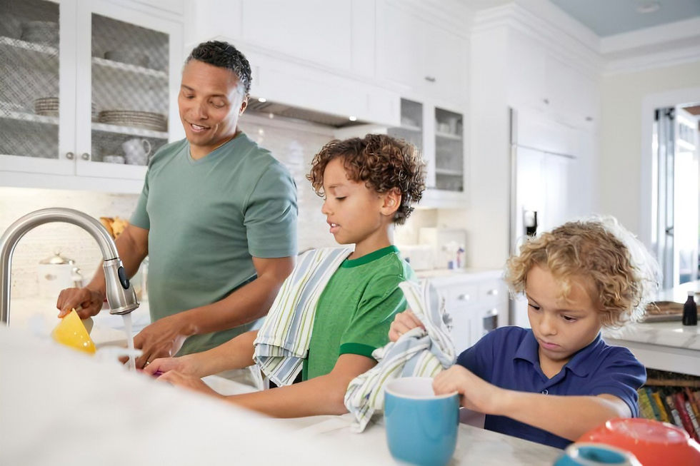 a man doing dishes with children
