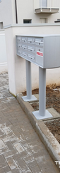 Installazione delle nuove cassette delle lettere condominiali con realizzazione di fori e massetti per alloggio dei pali di sostegno.