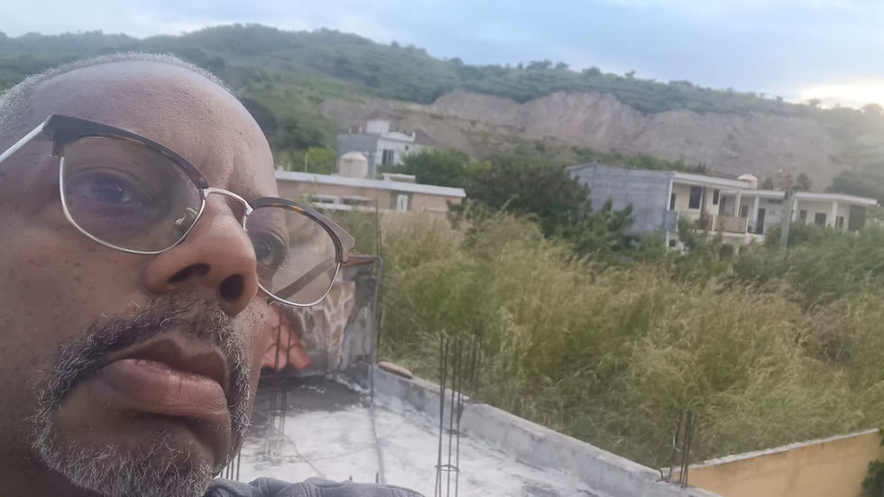 Mac taking a selfie on top of the home he shares with his beloved Myra