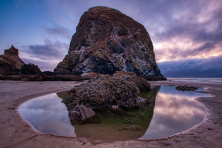 Dramatic reflection of Haystack Rock, Cannon Beach, OR