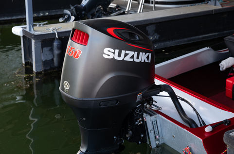 Close up image of Suzuki boat engine in Harbor 1 Marina at Columbia River