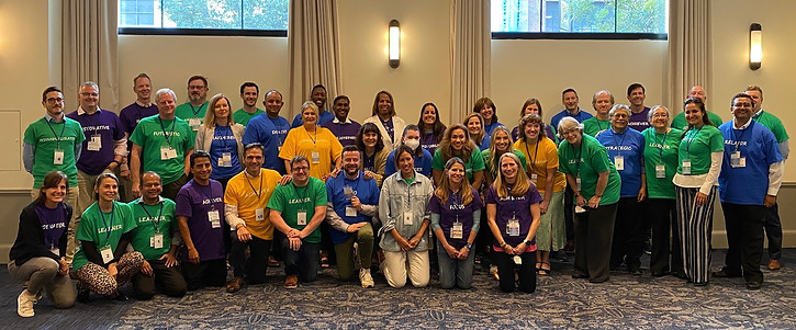large team participating in a Strengths Savvy team building workshop