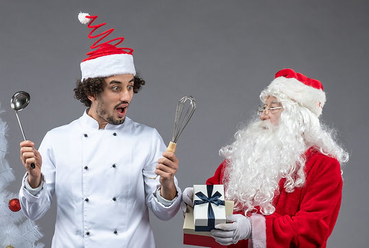 front-view-santa-claus-with-male-cook-around-christmas-presents-excited-grey-wall_edited.j