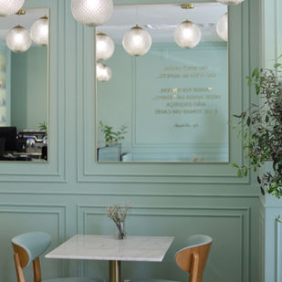 A beautiful cafe in Albufeira with mint green interiors