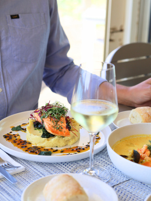A plate with salmon on top of mashed potato at a beach restaurant in Algarve