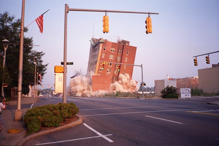 A building is demolished in an urban area using energetics manufactured by AES