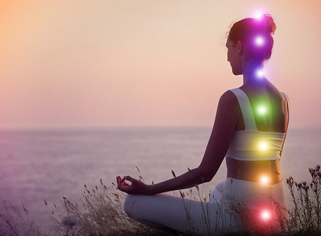 Woman meditating near sea Scheme of seven chakras, illustration.jpg
