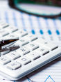 A picture of a calculator and financial documents