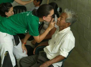 Dr. Pulsfus examns a patient in Ecuador