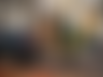 Junk removal worker loading furniture in driveway