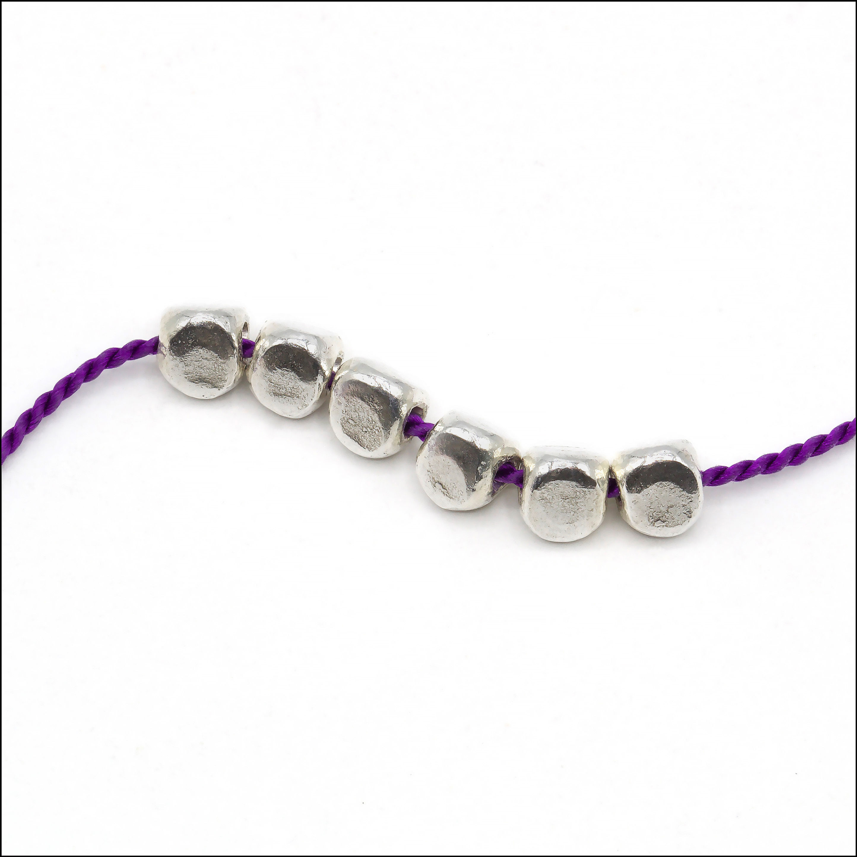 Hill Tribe Silver 3-sided shiny spacer bead measures 4.5mm x 4.5mm x 4.5mm with a 1.2mm hole.