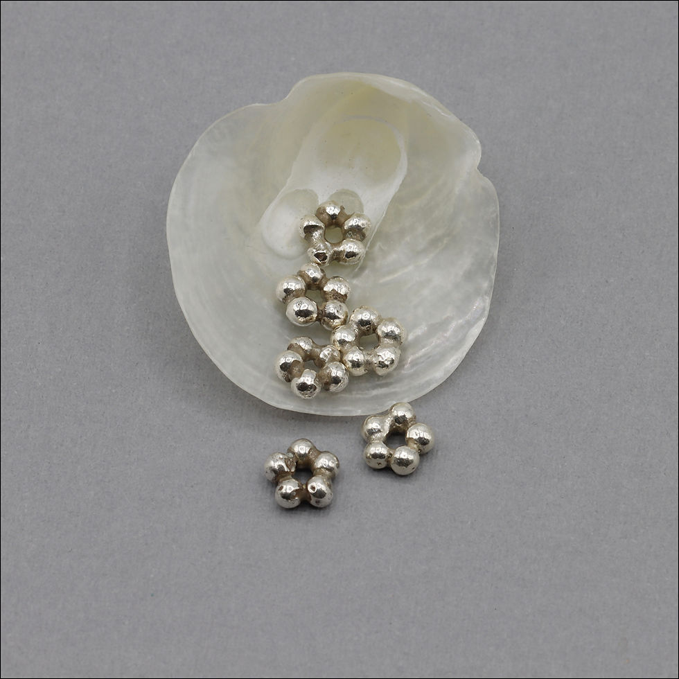 Hill Tribe Silver daisy spacer bead measures 6mm around with a 1.2mm hole.