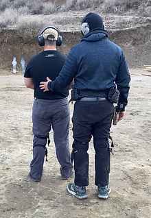 Kevin Pride giving individual instruction in defensive handgun firearms training.