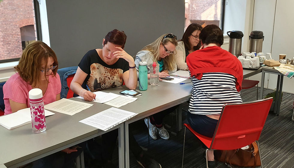 Picture showing translators working together in small groups at the workshop