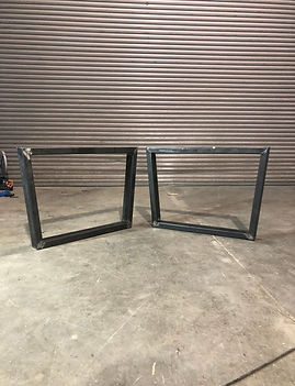 bespoke set of metal legs of a dining table top