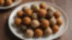 High angle view of an assorted plate of homemade energy balls