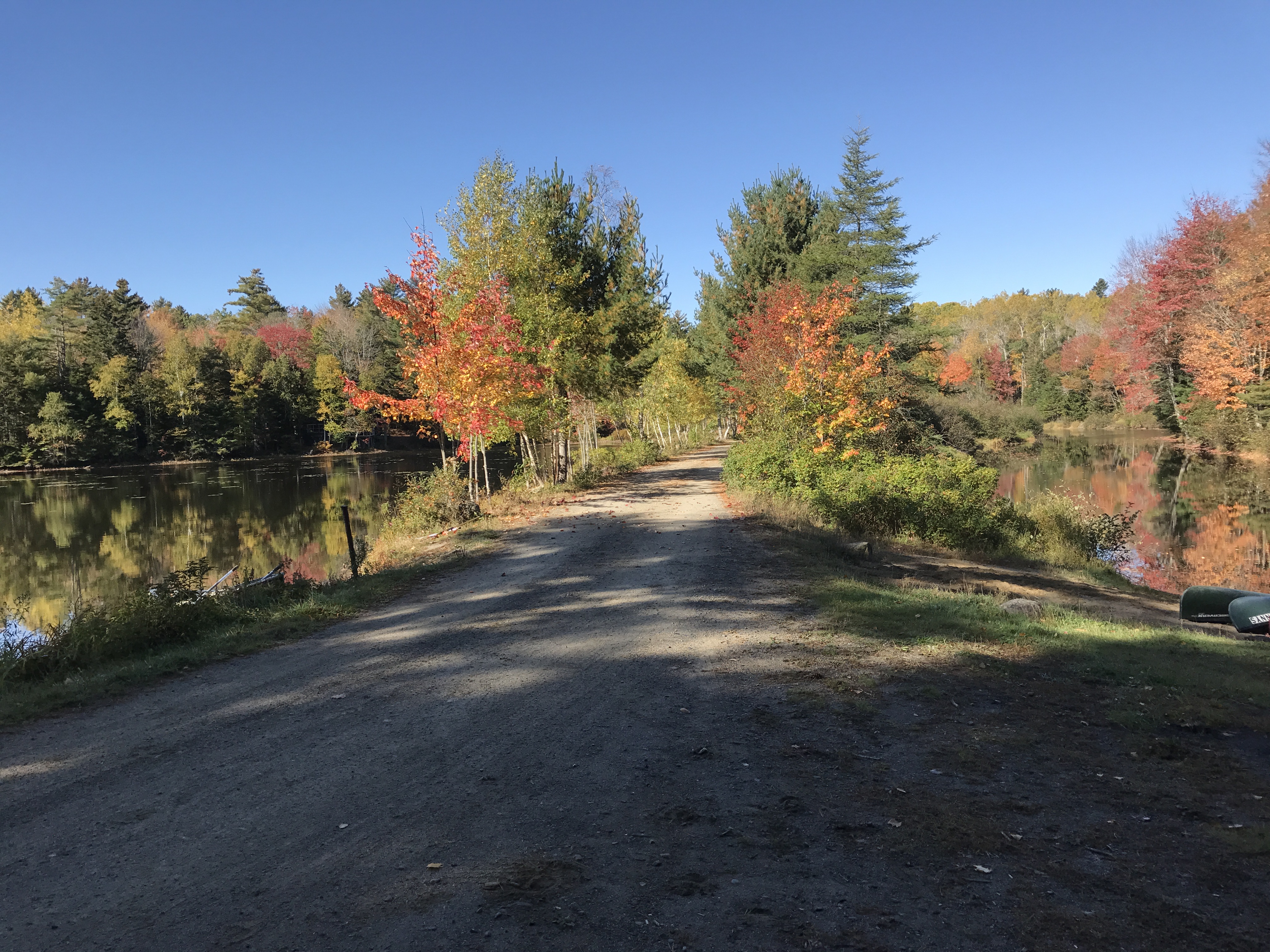 cottage road between pond and river