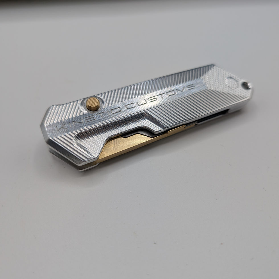 The Reaper BR1 custom pocket knife in silver and gold