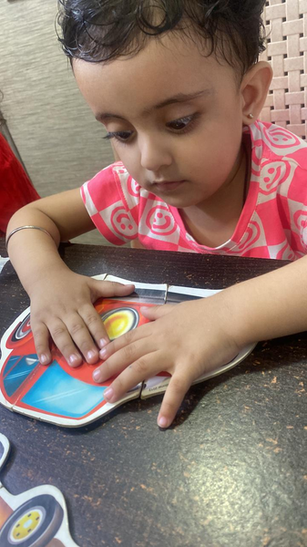 young boy focusing on his motor skills