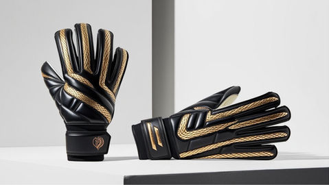 A pair of black goalkeeper gloves with golden accents, featuring pro-grade latex palms, reinforced finger protection, breathable mesh panels, and an adjustable wrist strap for ultimate grip, comfort, and durability.