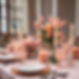 pink and peach flowers on a dinner party table with place settings and candles.jpg