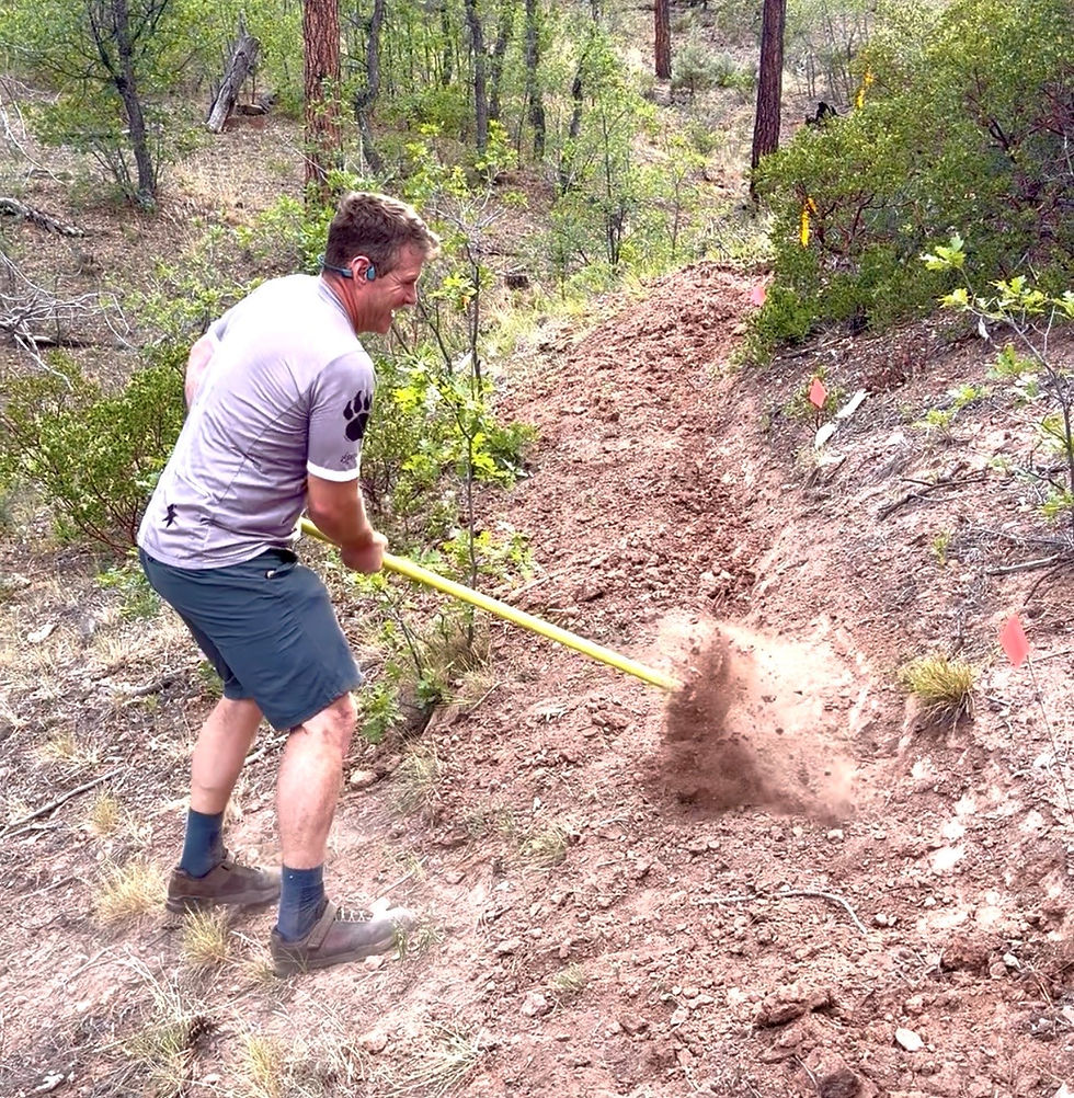 STBVF Board Member Dave Moore helping to bench cut an area on Petrified on June 7, 2026. Look at that dirt fly! See that grin? Trail work is hard . . . but fun!