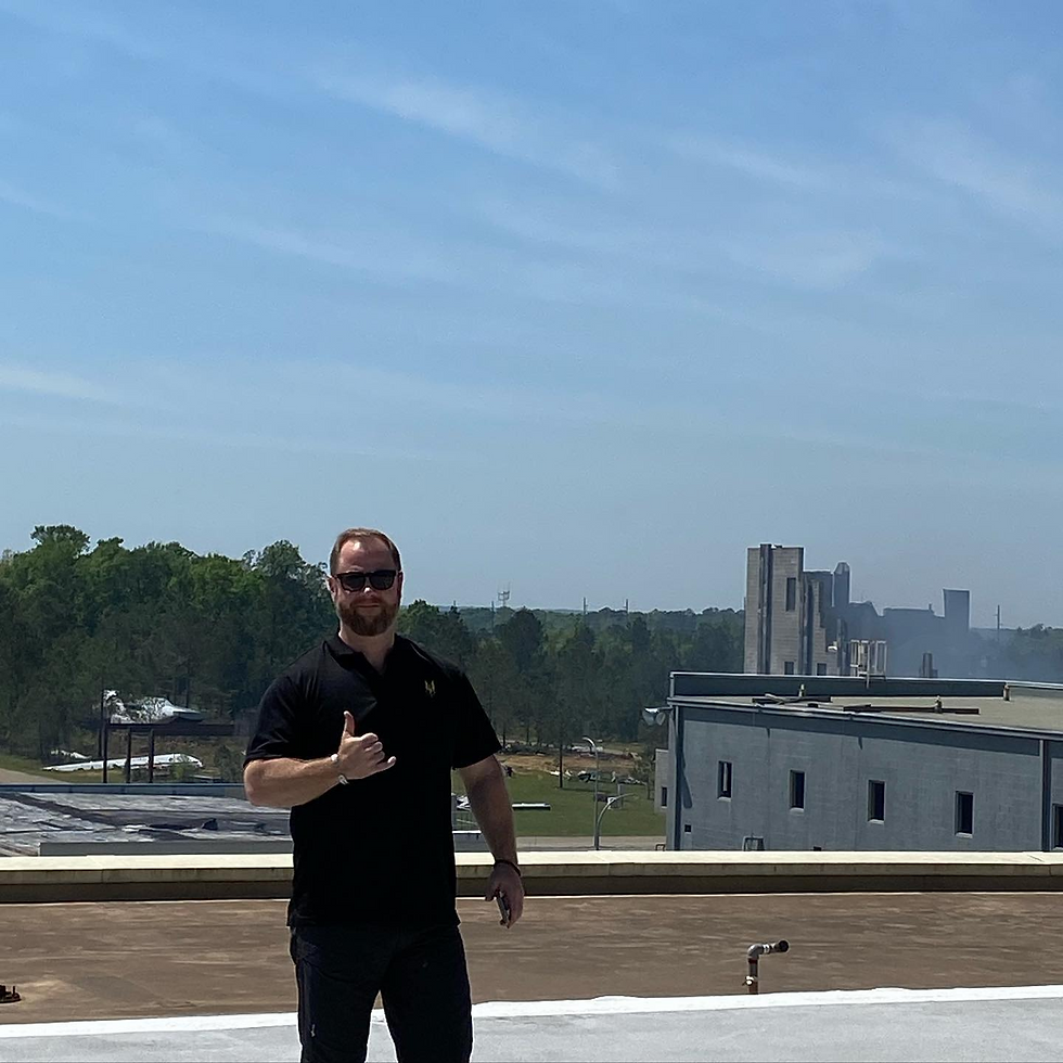 AEP Co-Founder Erik Mineo, on a rooftop at Guardian Centers