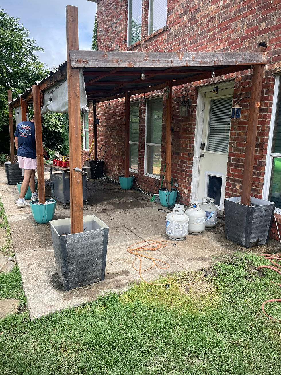 Core Lift junk removal team clearing a backyard patio pergola.