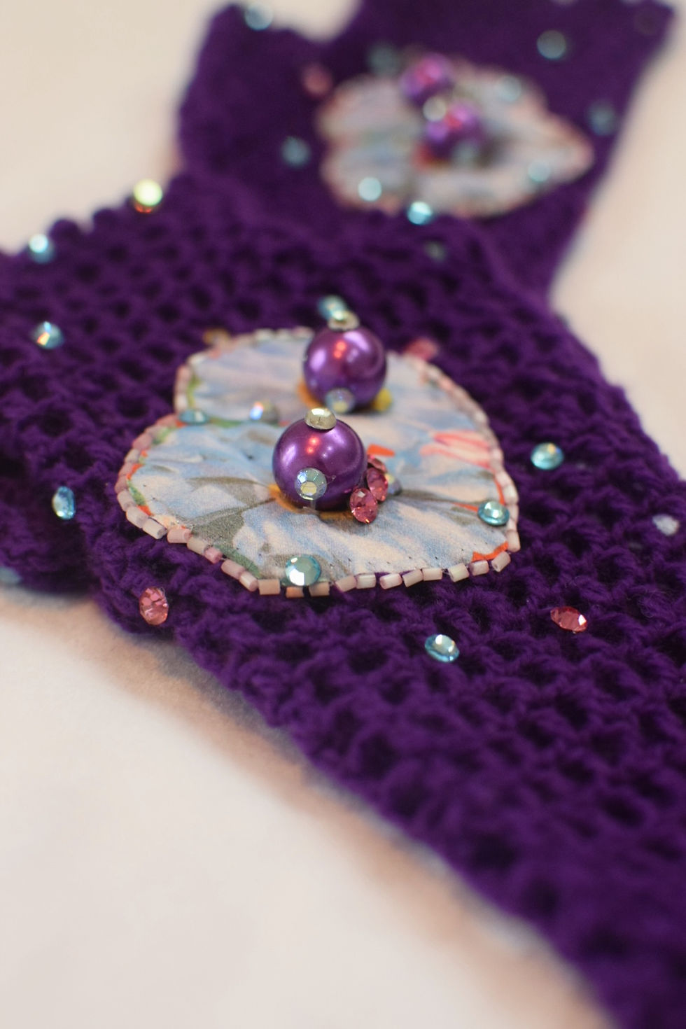 Thumbnail: Vibrant purple and blue silk flower fingerless crochet gloves