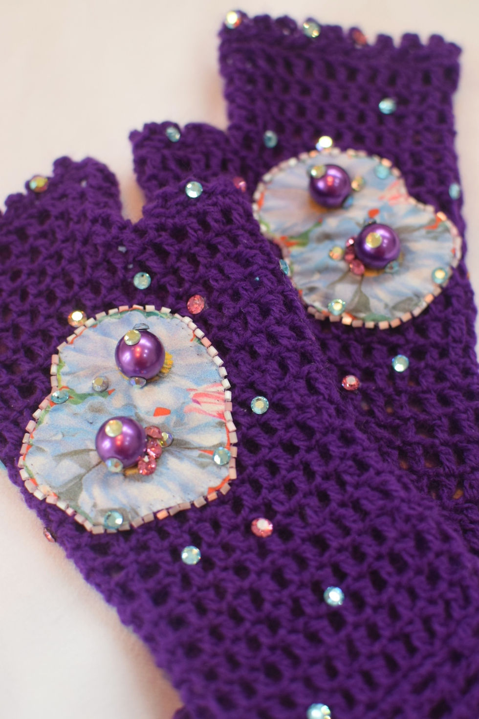 Thumbnail: Vibrant purple and blue silk flower fingerless crochet gloves