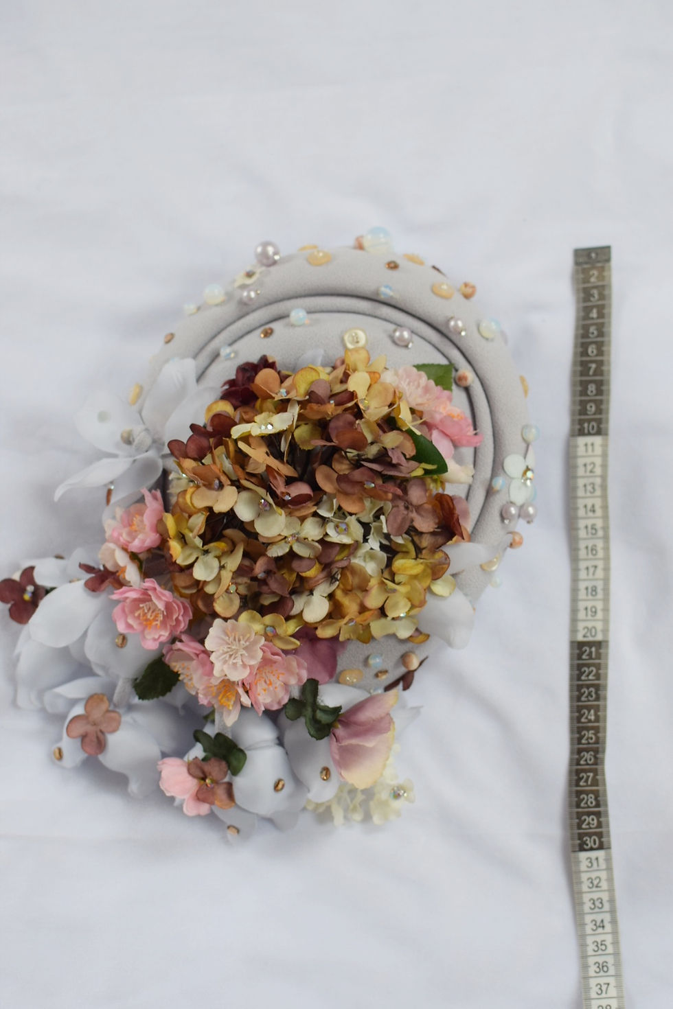 Thumbnail: Dusty hydrangeas,  cherry blossoms and moonstones lilac pillbox hat