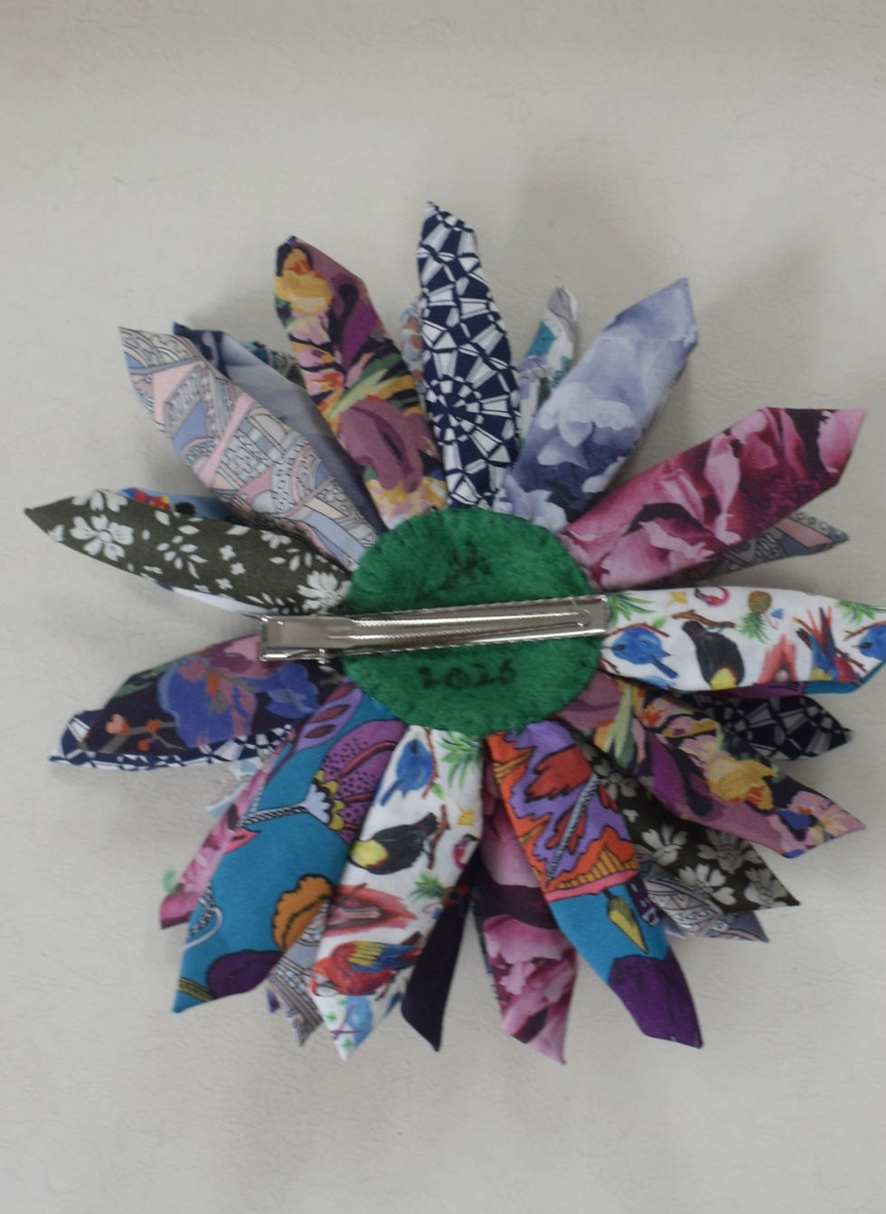 Thumbnail: Large Liberty print cotton flower clip on darker colours and white and blue