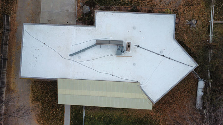 Completed TPO roofing system with white reflective membrane installed in Boise, ID by Dodd Roofing and Exteriors
