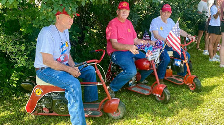 Doodle Bug Scooter riders (representing the Doodle Bug Club of America) on July 4 in Williams, IA!
