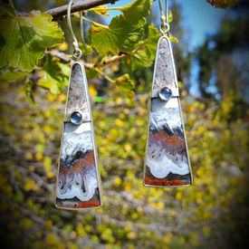 Opalized wood earrings that resemble a mountains in fall landscape with moonstone accents set in argentium silver