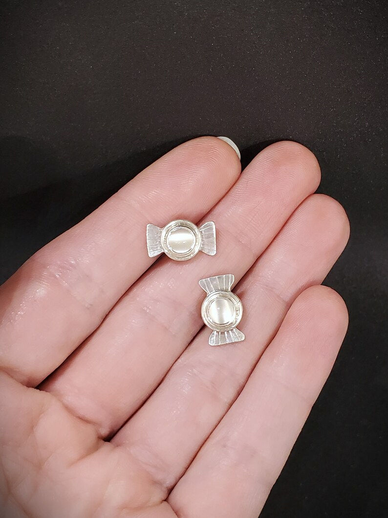 Thumbnail: Cateye white moonstone post earrings resembling little candies