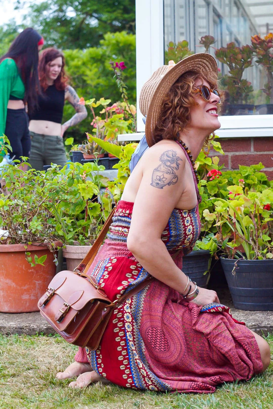 Smiling customer holding a rare Philodendron purchase at Plantstock 2025 plant sale.