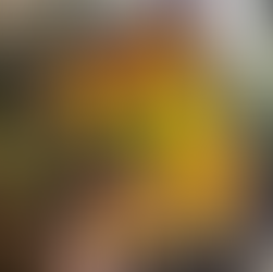 Plant lover posing with You’re Overwatering It! A Plant Guru’s Guide to Houseplants by The Bearded Plantaholic.